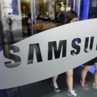 Students walk out of a showroom at the headquarters of Samsung Electronics in Seoul