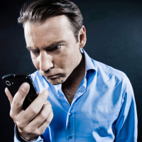 Man-Angry-Holding-Smartphone-1