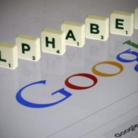 Letters spell the word „Alphabet“ as they are seen on a computer screen with a Google search page in this photo illustration taken in Paris