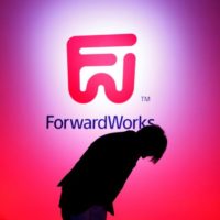 ForwardWorks Corporation’s executive director Kawaguchi bows during ForwardWorks Beginning event in Tokyo